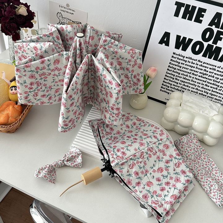 Dame sammenleggbare paraply med blomsterdesign og praktisk oppbevaringssystem Skanto
