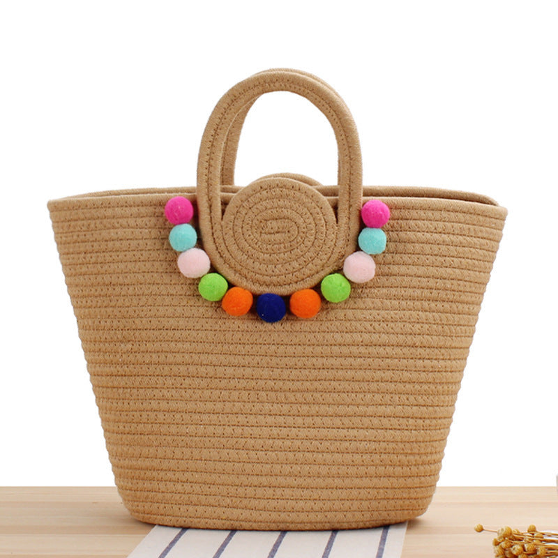Modern handbag with playful pom-pom embellishments Skanto