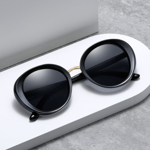Dame vintage solbrille i elegant skjolddesign Skanto