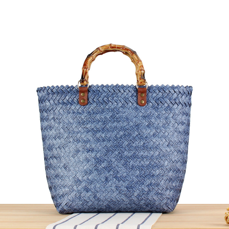 Handbag made of high-quality, braided material with bamboo handle Skanto