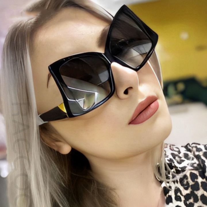 Damer oversized solbriller med elegant kvadratisk ramme og beskyttende UV-beskyttelse Skanto