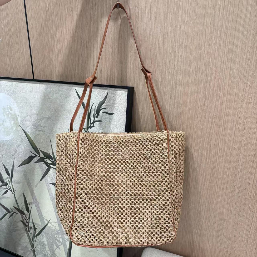 Håndlaget nettheldebag med lærdetaljer Skanto