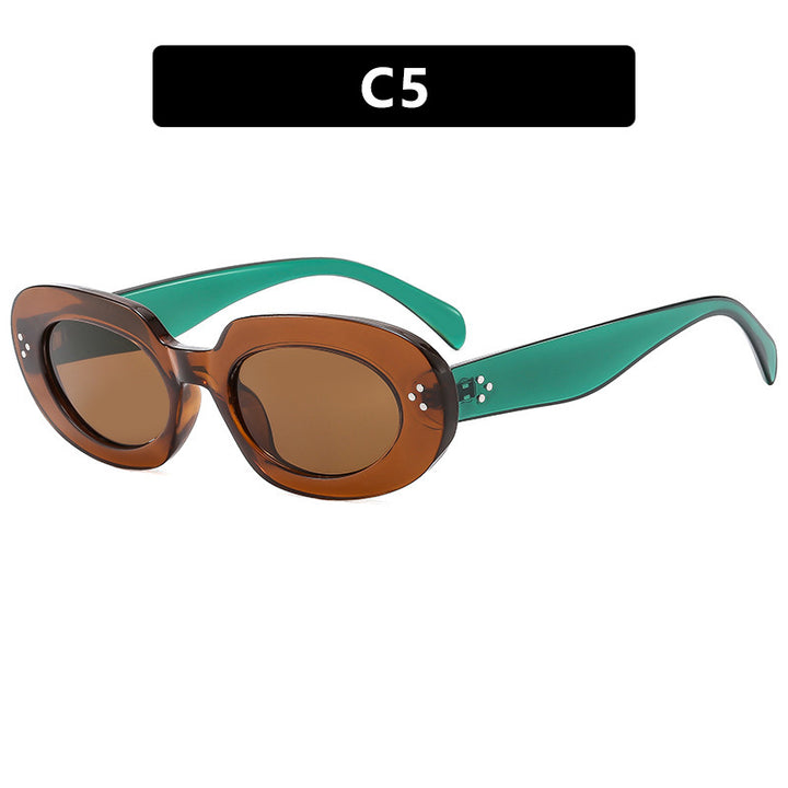 Dame moteriktig solbrille med unikt ovalt ramme og beskyttende glass Skanto