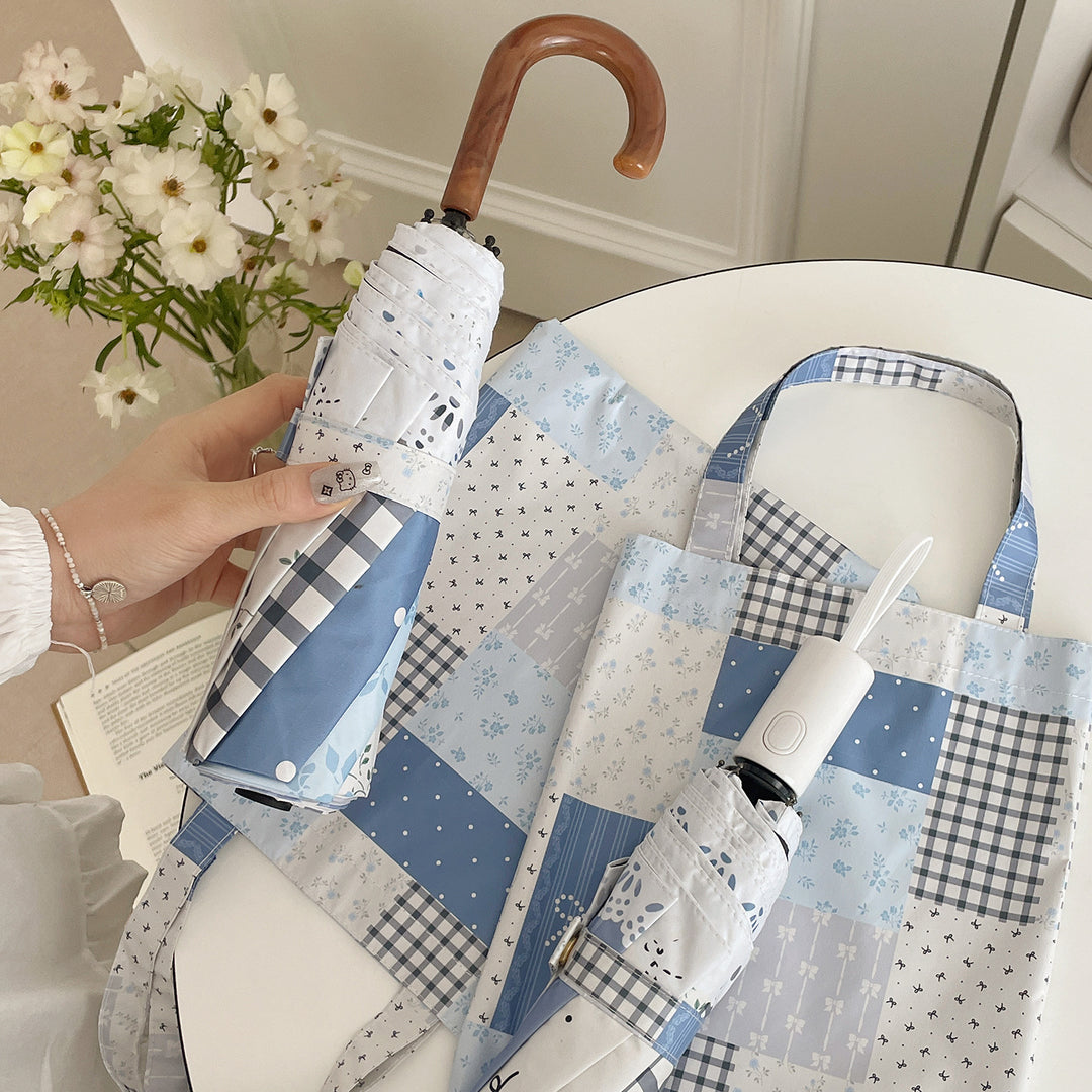 Damer paraply i romantisk patchwork-design Skanto