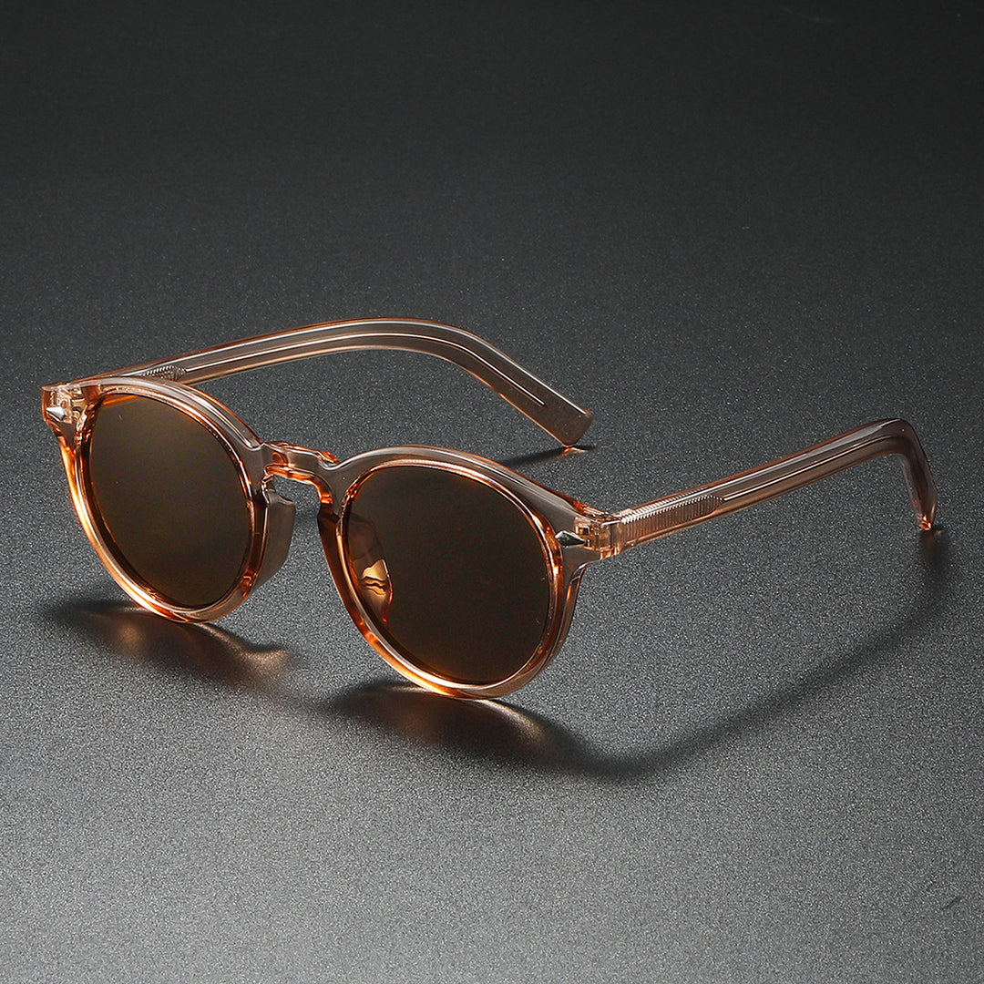Dame Rund-solbrille med transparent ramme og reflekterende glass Skanto