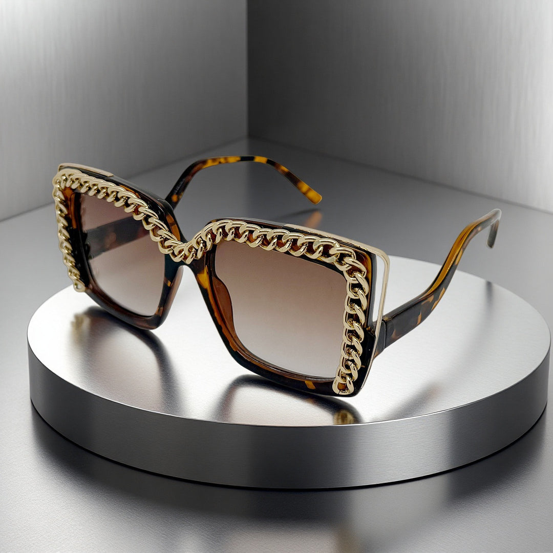Dame moteriktig oversized solbrille med kjederamme Skanto