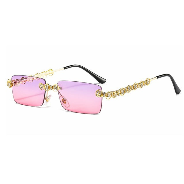 Dame Designer-solbrille med glitrende ramme og rektangulært glass Skanto