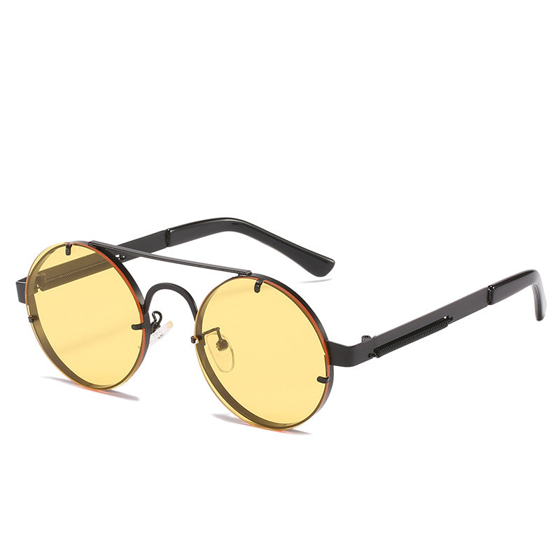 Dame rund designer solbrille med innovativ metallramme og beskyttende linser Skanto