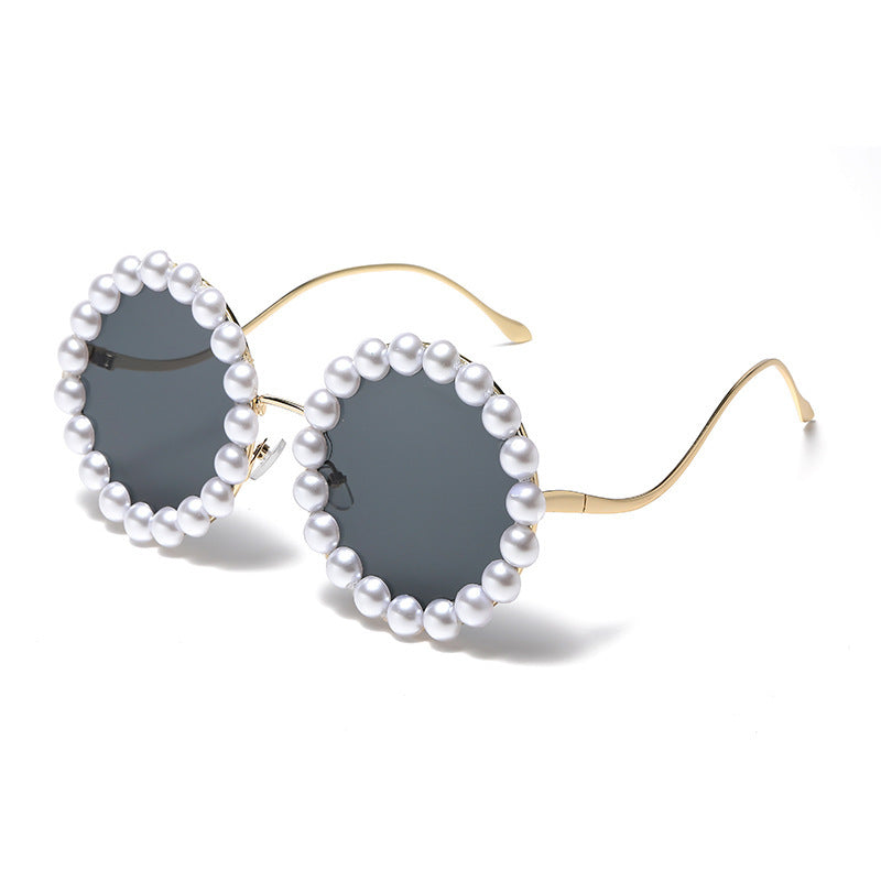 Dame designer-solbrille med perlebesatt ramme Skanto