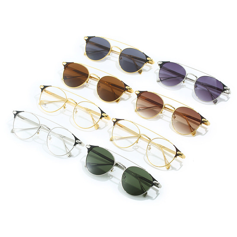 Dame rund Vintage-solbrille med høykvalitets metallramme og robust design Skanto