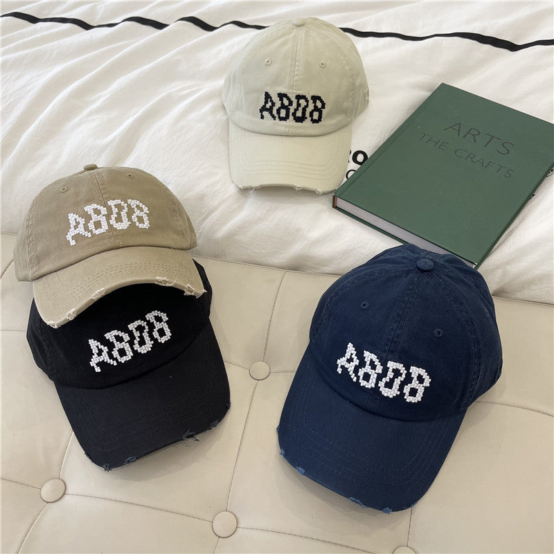 Kvinnens slitte bomull baseballcaps med grafisk detaljer Skanto