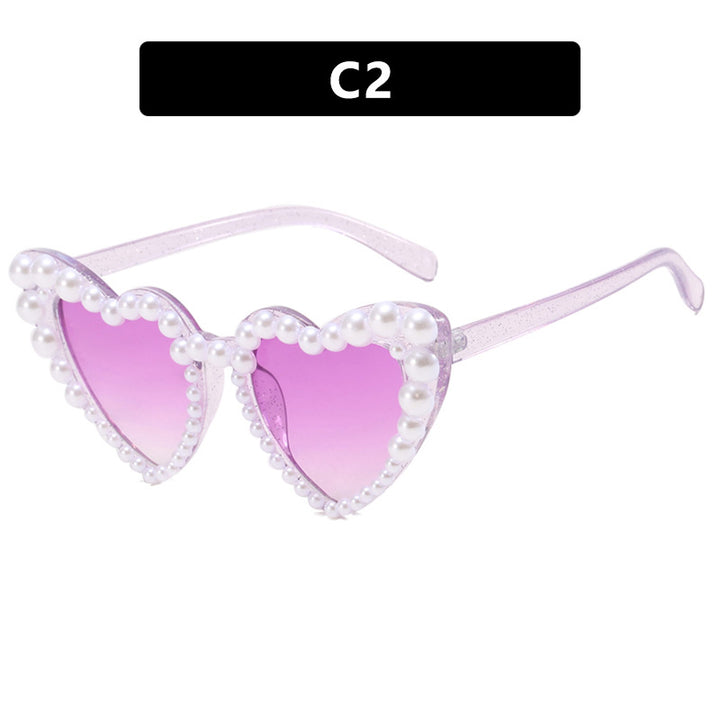 Dame hjerteformet solbrille med perlebesatt ramme Skanto