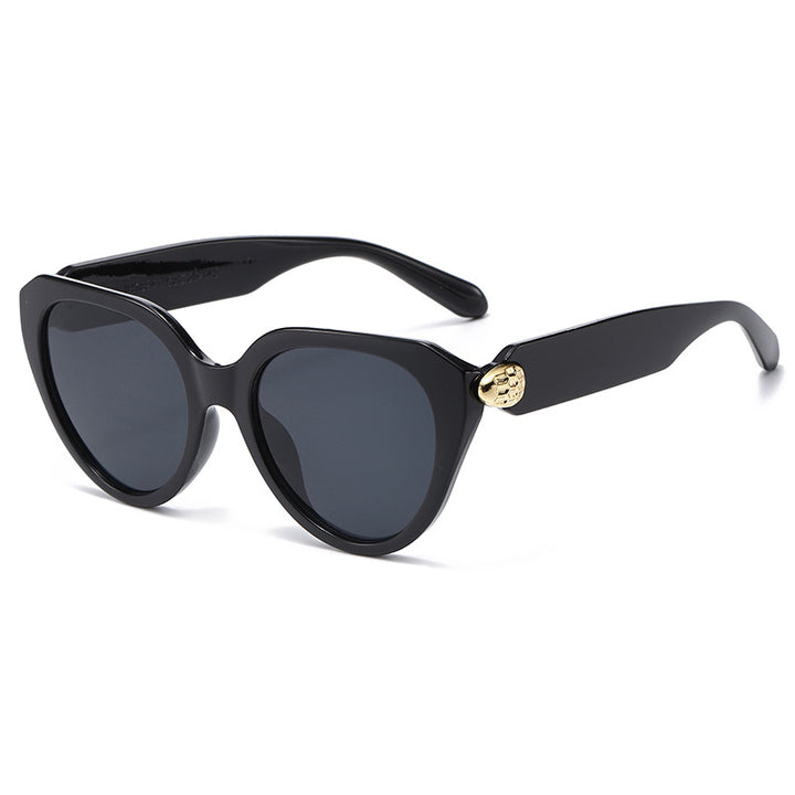 Dame Cat-Eye solbriller med gullige detaljer og beskyttende UV-filter Skanto