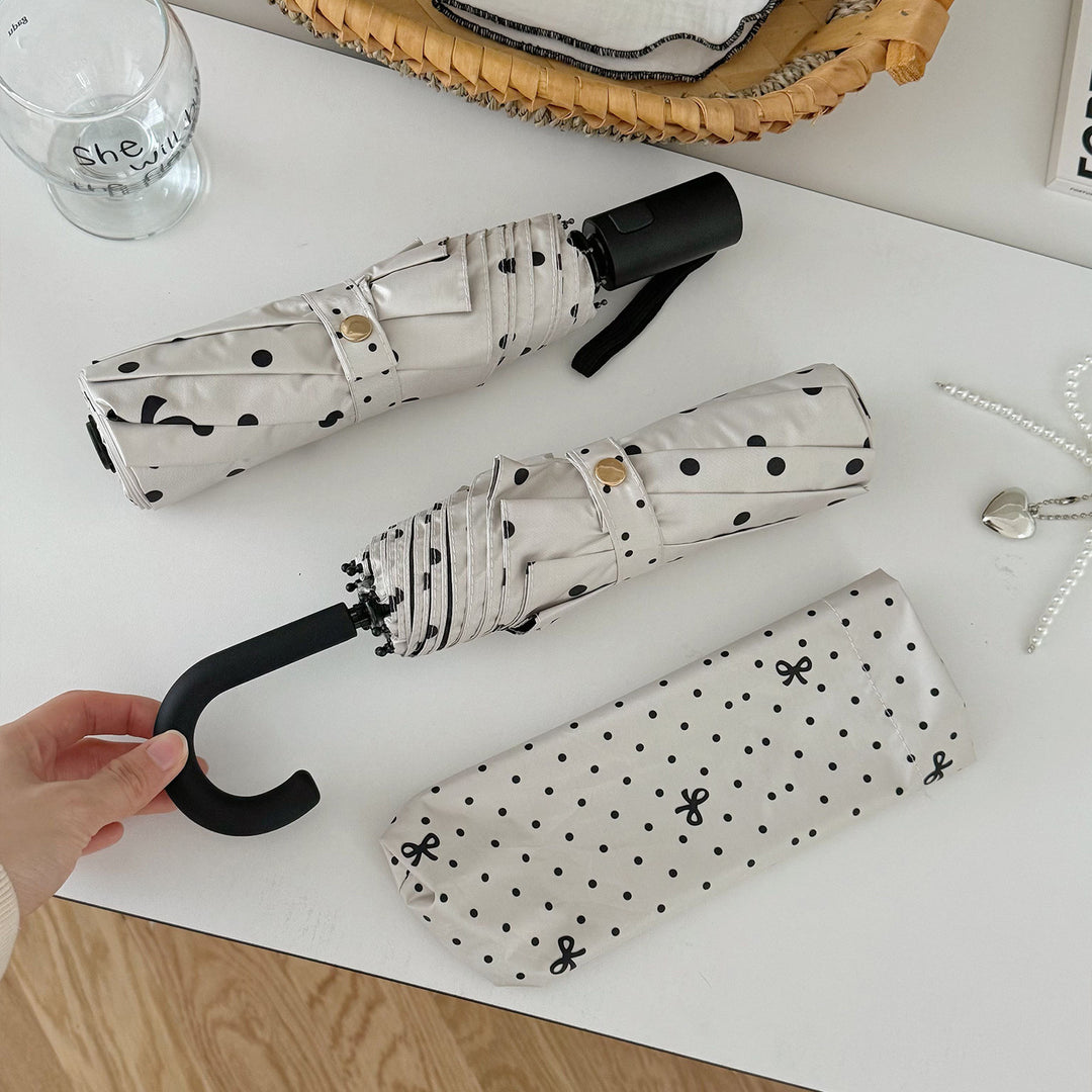 Dame kompakt paraply med stilfull prikkedesign Skanto
