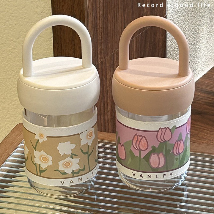 Dame isolerende drikkeflaske med ergonomisk håndtak og elegant blomsterdesign Skanto