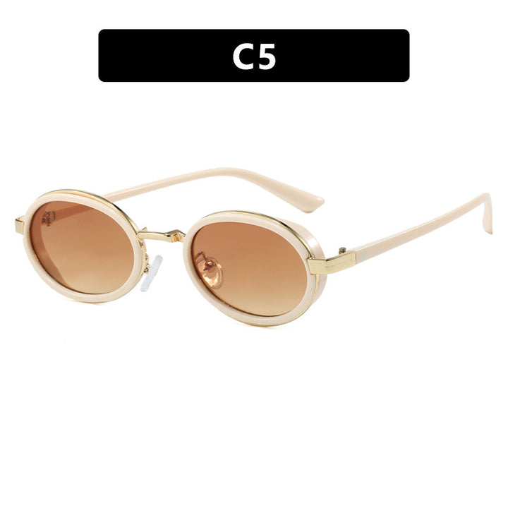 Dame rund solbrille med lette glass og gyldne detaljer Skanto