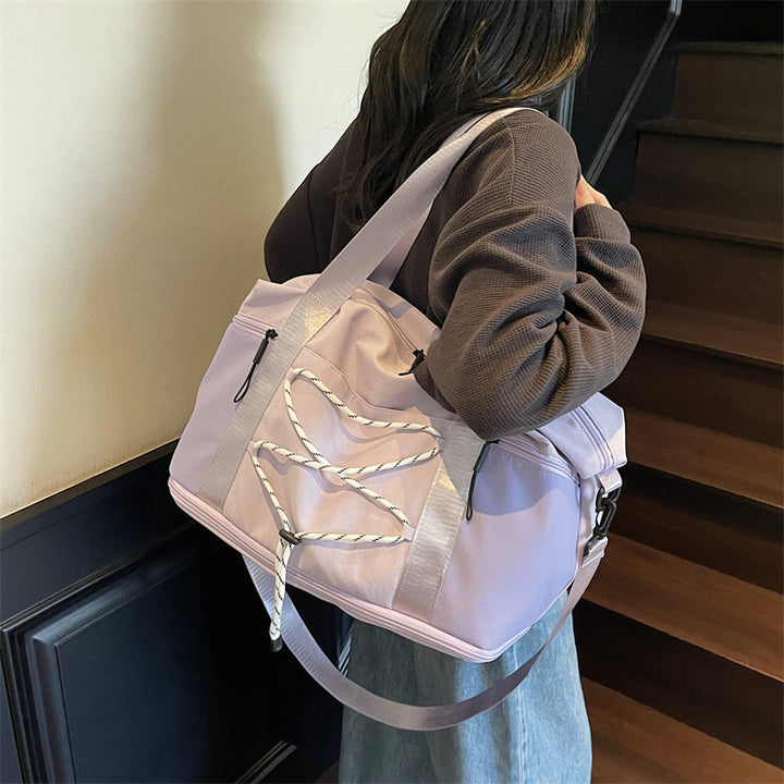 Sporty skulderveske med praktisk organizer Skanto