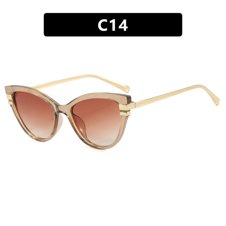 Dame Cat-Eye solbriller med elegant plastramme og gullaccentuer Skanto