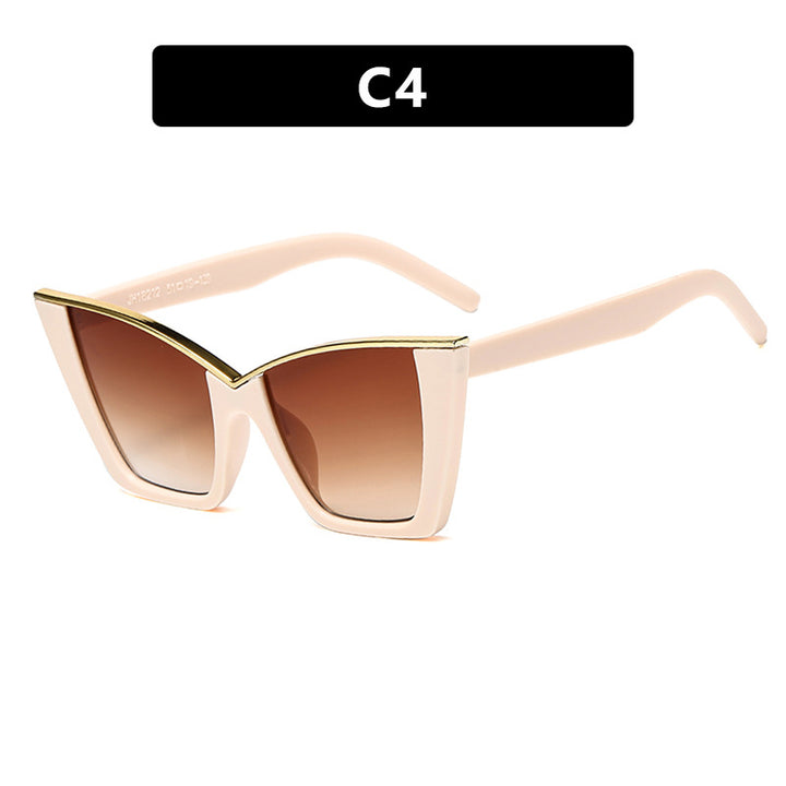 Dame ekstravagant solbrille med unik design og gullige aksenter Skanto