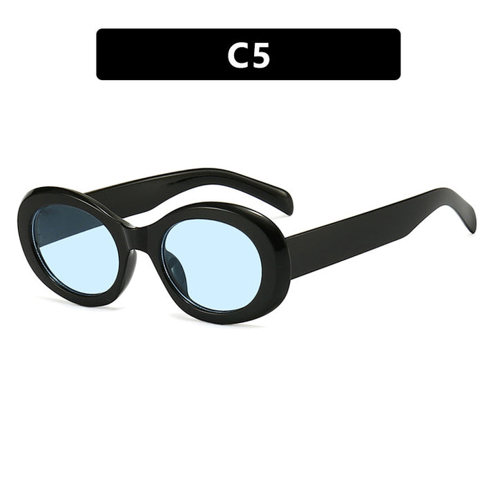 Dame moteriktig solbrille i original oval design med transparent ramme og UV-beskyttelse Skanto