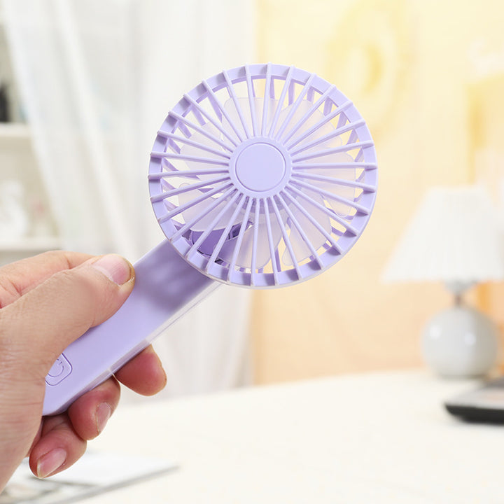 Kvinne bærbar håndholdt vifte med ergonomisk design og rask luftstrøm Skanto