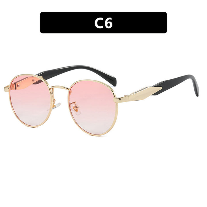 Dame rund solbrille med elegant, gullramme og UV-beskyttelse Skanto