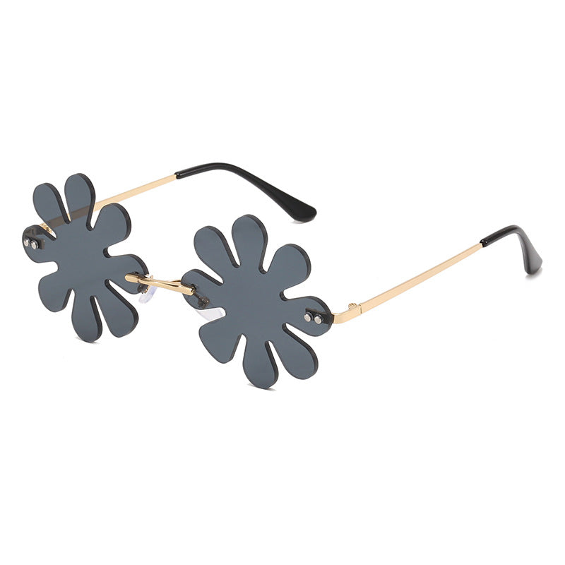 Dame Lekker blomster-solkors med stilfull metallramme Skanto