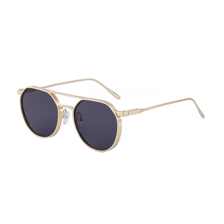 Dame moterik solbrille i stilfullt rundt design Skanto