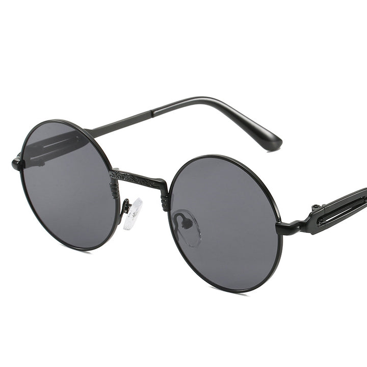 Dame rund modisk solbrille med fint metallramme Skanto