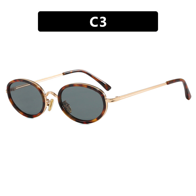 Dame elegant rund solbrille med moderne metallramme Skanto