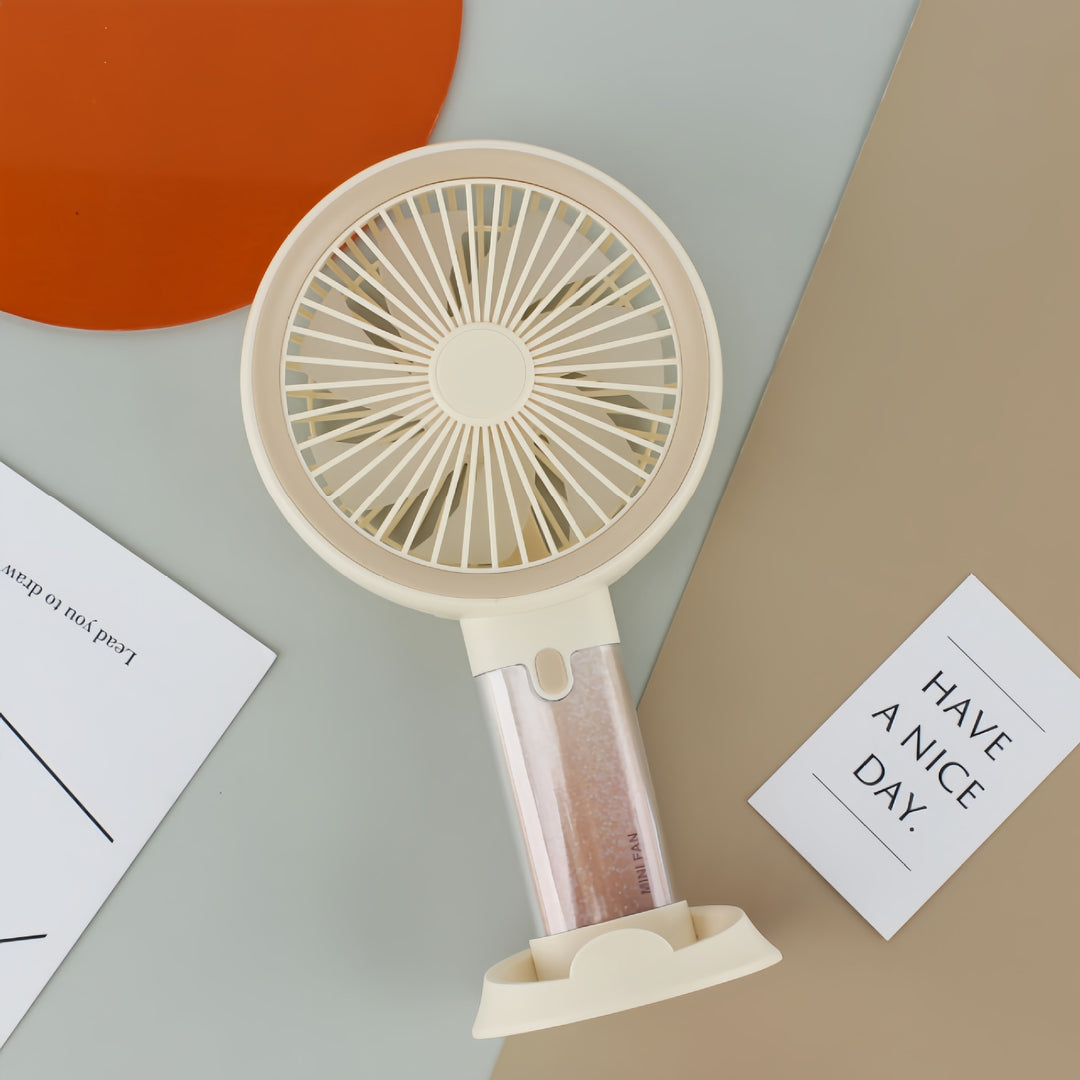 Dame bærbar mini-håndvifte med sprayfunksjon og ergonomisk design Skanto