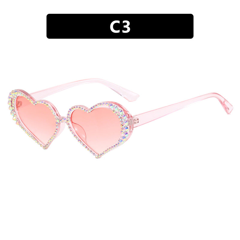 Dame hjerteformet solbrille med strassbesatt ramme Skanto