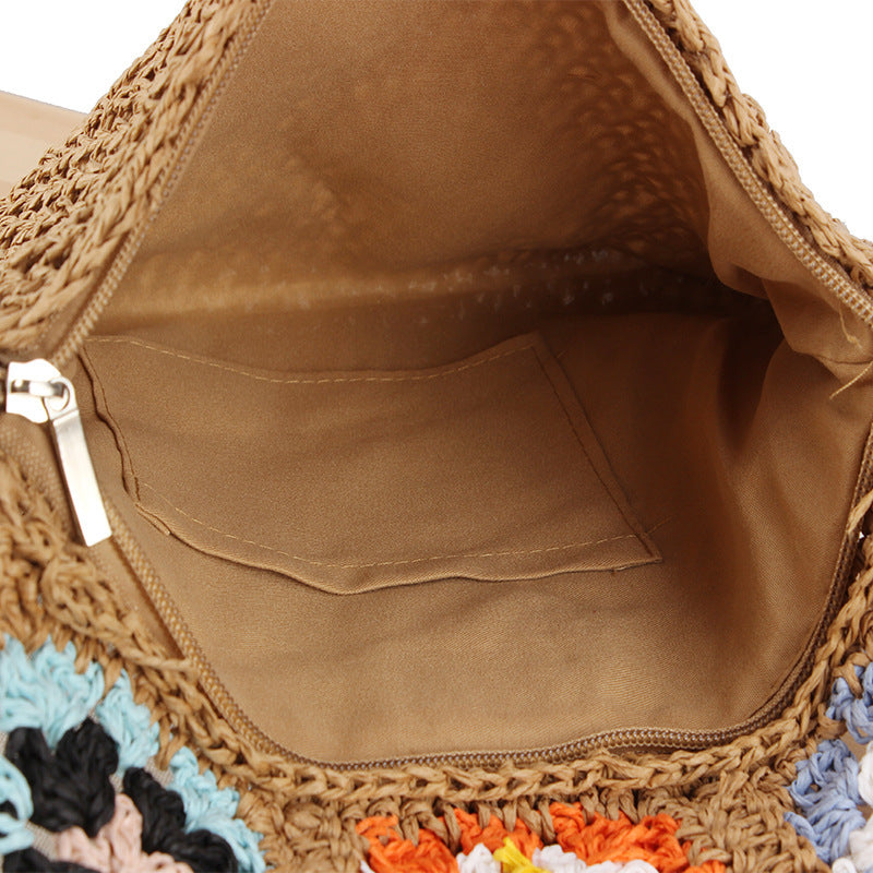 Hand-knotted shoulder bag with colorful floral design Skanto