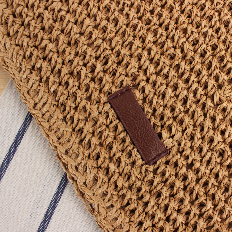 Shoulder bag in woven natural material with detachable leather strap Skanto