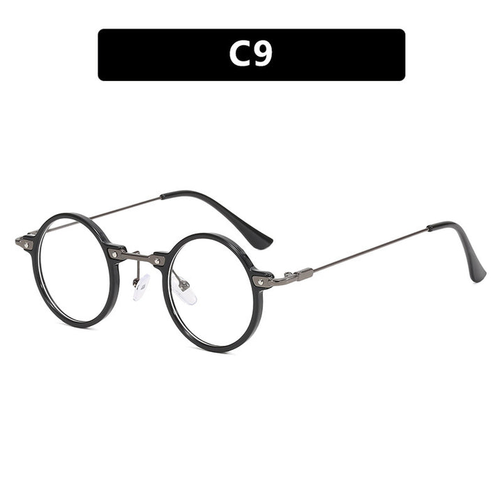 Dame rund solbrille med moderne metallramme og store blå linser Skanto