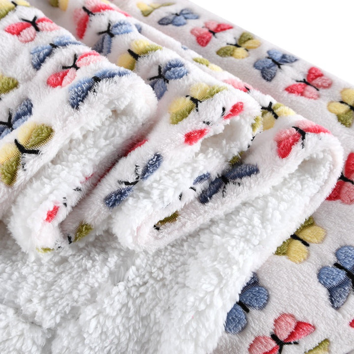 Damer Fleece-kosedekken med vendbart design Skanto