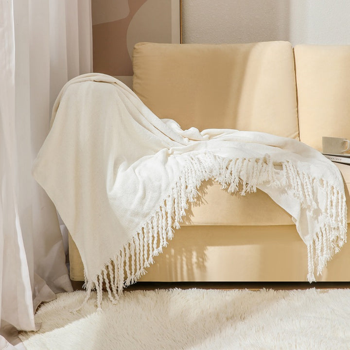 Kvinnelig elegant og stilfull sofa teppe med frynser Skanto