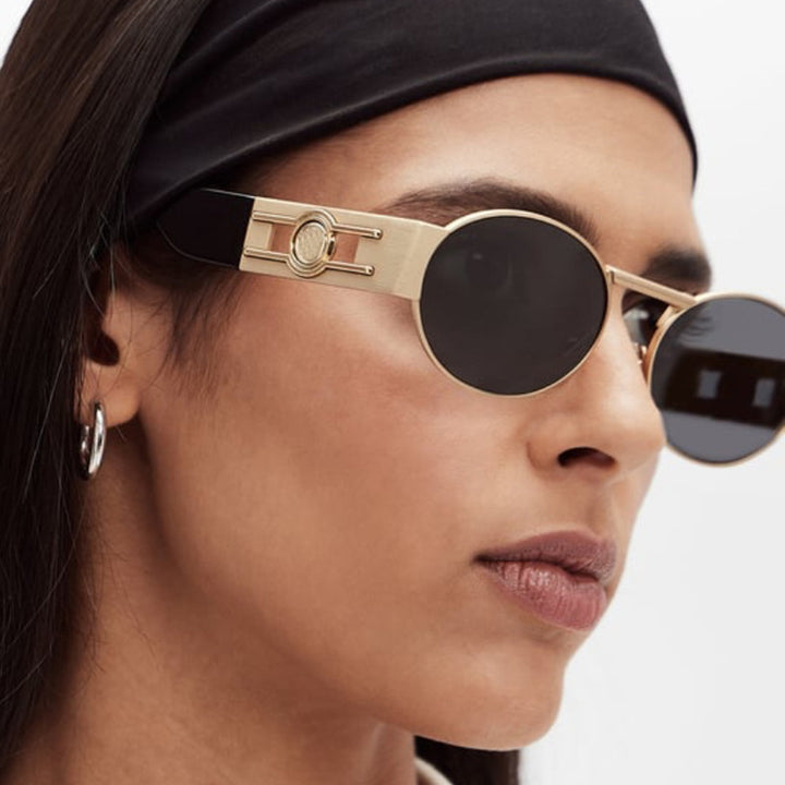 Dame rund solbrille med moderne metallramme og UV-beskyttelse Skanto
