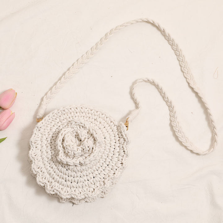 Håndheklede crossover-veske med florale detaljer Skanto