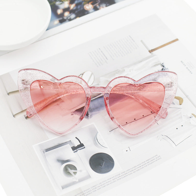 Dame hjerteformet solbrille med glitrende ramme Skanto