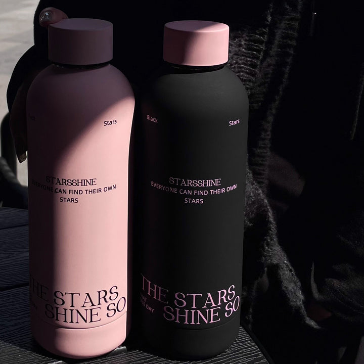 Dame termoflaske med ergonomisk design og praktisk bærehank Skanto