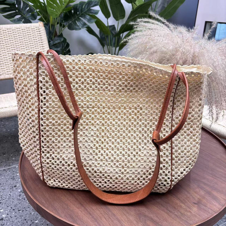 Håndlaget nettheldebag med lærdetaljer Skanto