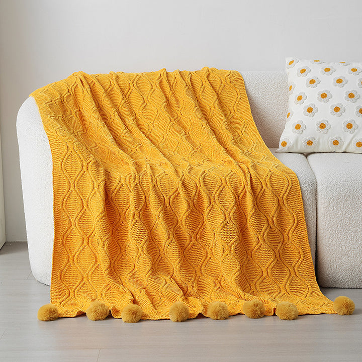 Dame strikket teppe med dekorative pom poms Skanto