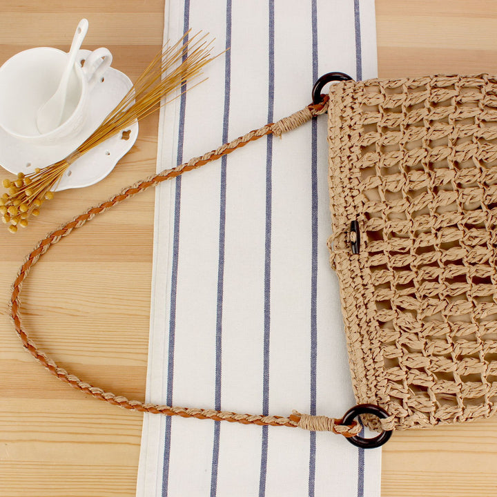 Handbag made of hand-woven natural material with decorative clasp Skanto