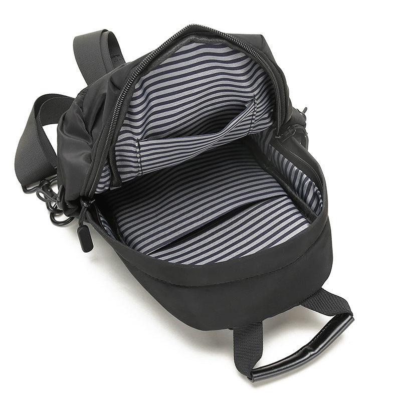 Sling-veske med multifunksjonelt design Skanto