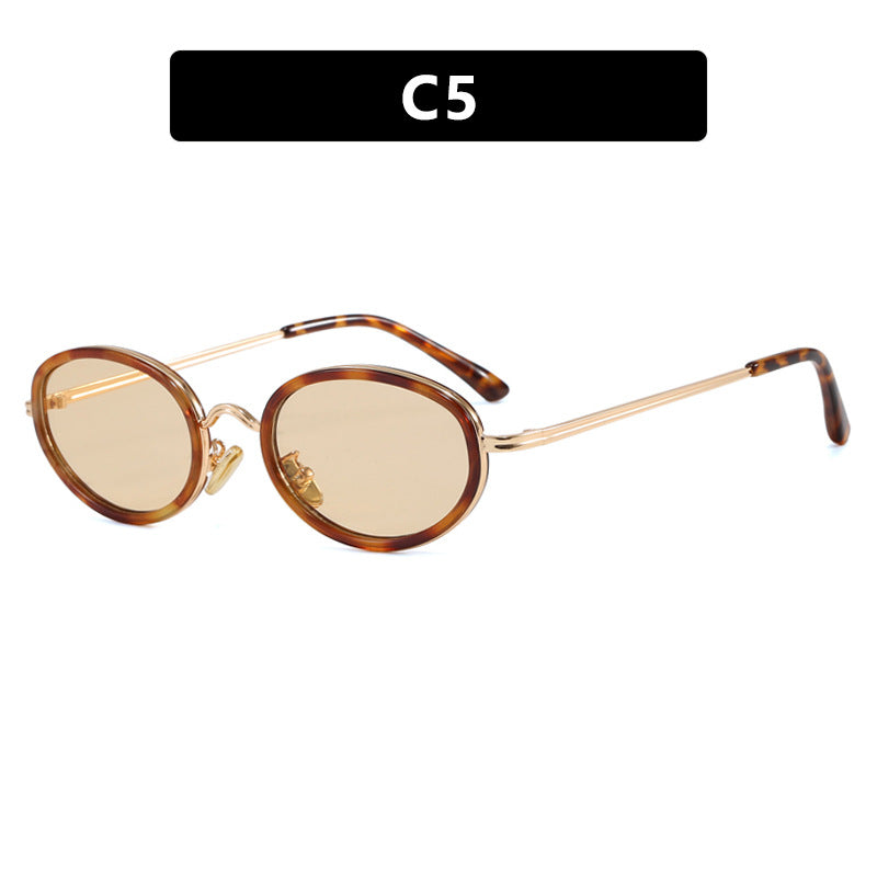 Dame elegant rund solbrille med moderne metallramme Skanto