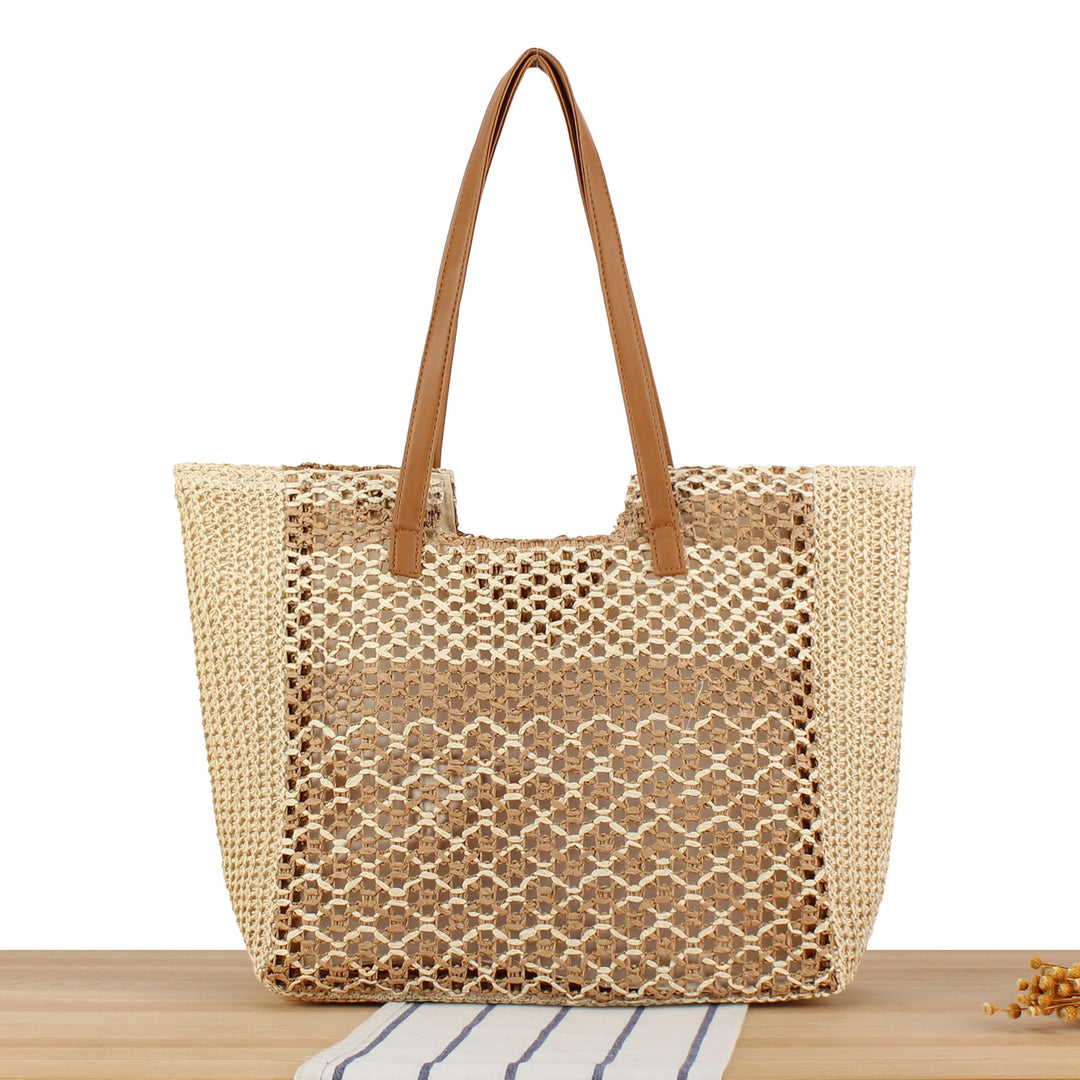 Tote bag made of woven natural material with elegant leather handles Skanto