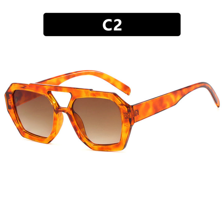Dame oversized solbrille i markant, åttkantet design Skanto
