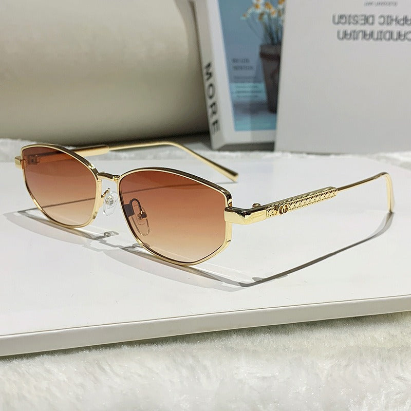 Dame elegant solbrille med glitrende metallramme Skanto