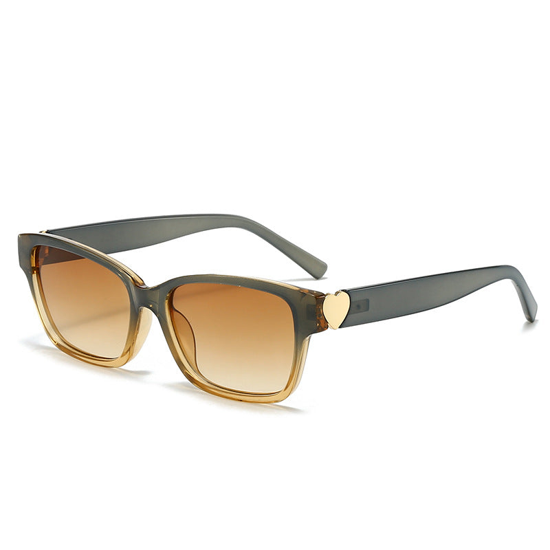 Dame moterik kvadratisk solbrille med hjerte-senter Skanto